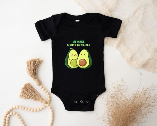 a baby bodysuit with two avocados on it