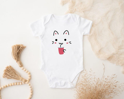 a white bodysuit with a cat face on it