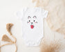 a white bodysuit with a cat face on it