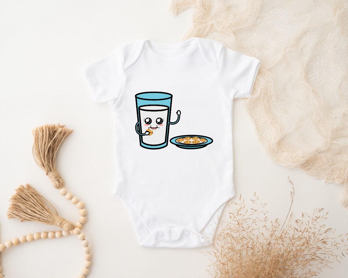 a baby bodysuit with a picture of a glass of milk and a plate of