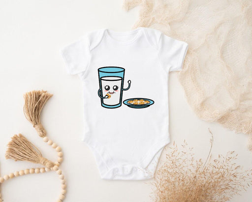 a baby bodysuit with a picture of a glass of milk and a plate of