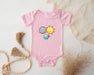 a baby bodysuit with a picture of the sun and moon on it