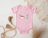 a baby bodysuit with a picture of a coffee cup and donut on it