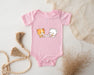 a baby bodysuit with a picture of a cat and a dog on it