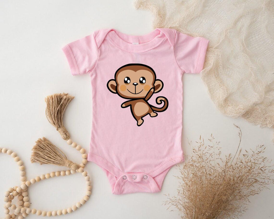 a pink baby bodysuit with a cartoon monkey on it