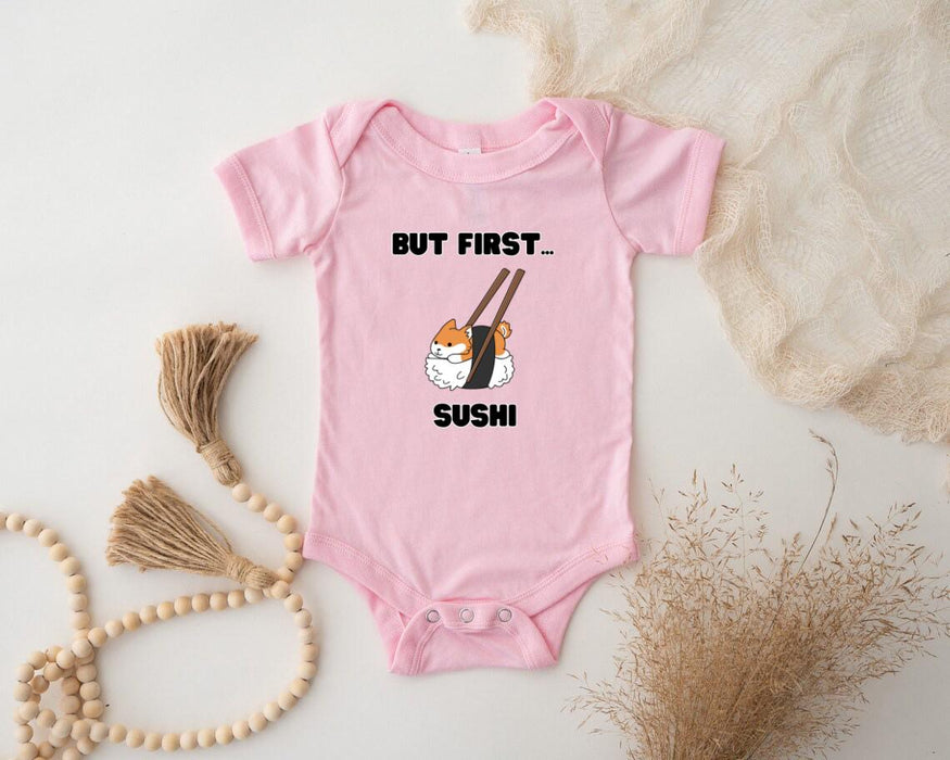 a pink baby bodysuit with a picture of a sushi on it