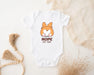 a white bodysuit with a cartoon fox on it
