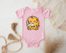 a baby bodysuit with a cookie on it