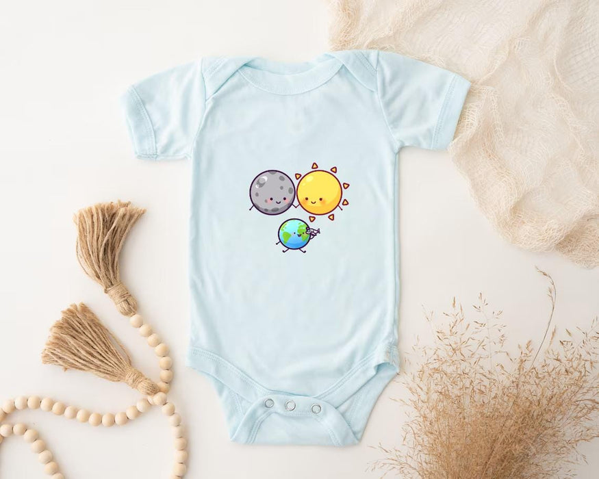a baby bodysuit with a picture of a sun and a planet on it