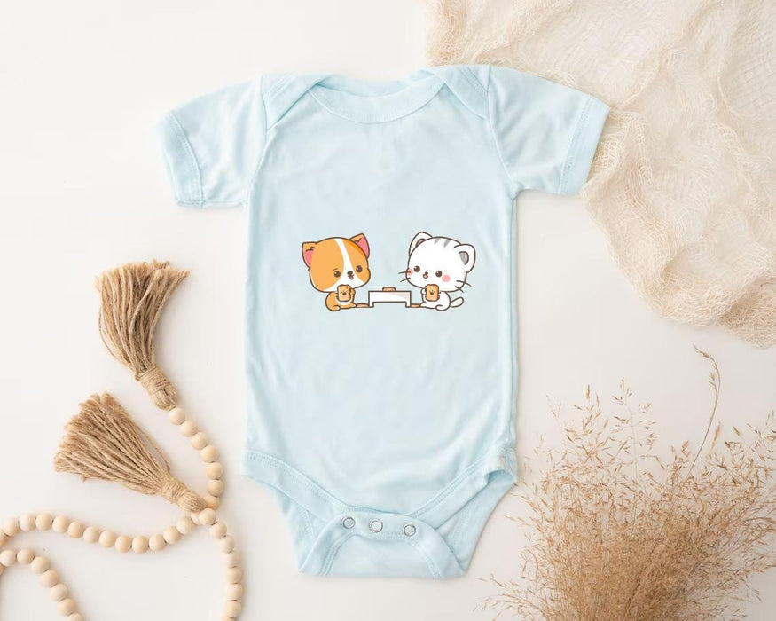 a baby bodysuit with a picture of a cat and a dog on it