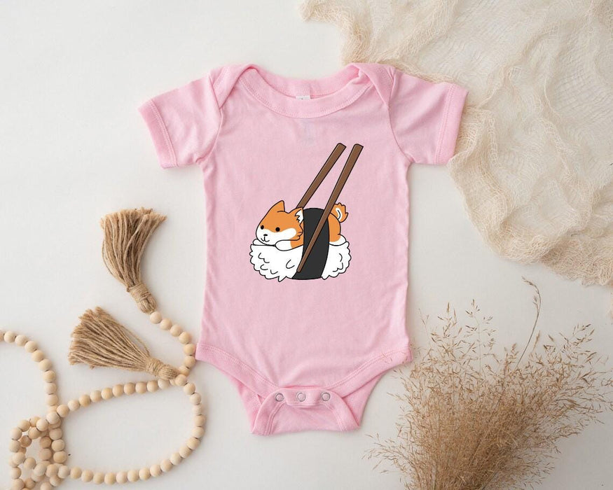 a pink bodysuit with a picture of a cat holding chopsticks
