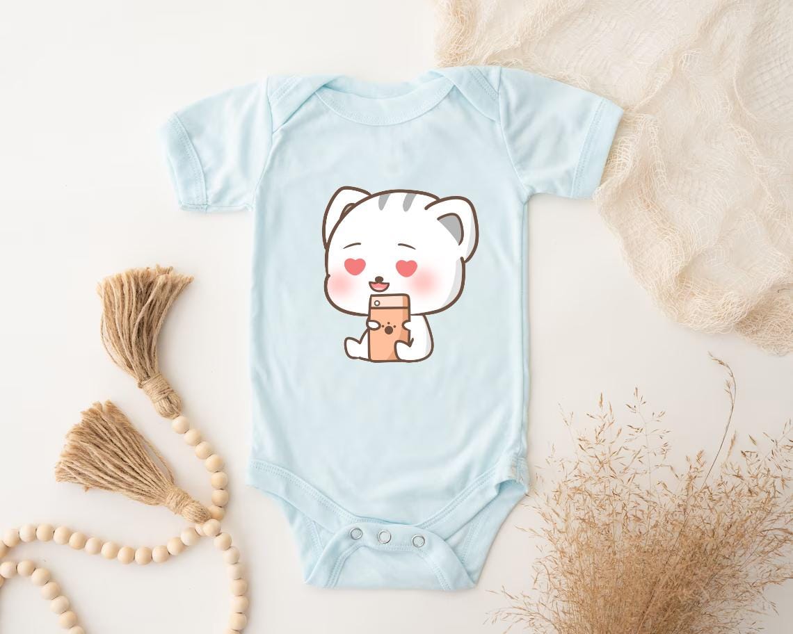 a baby bodysuit with a picture of a bear holding a cup