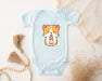a baby bodysuit with a corgi design on it