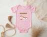 a baby bodysuit with a picture of a bowl of food and a taco