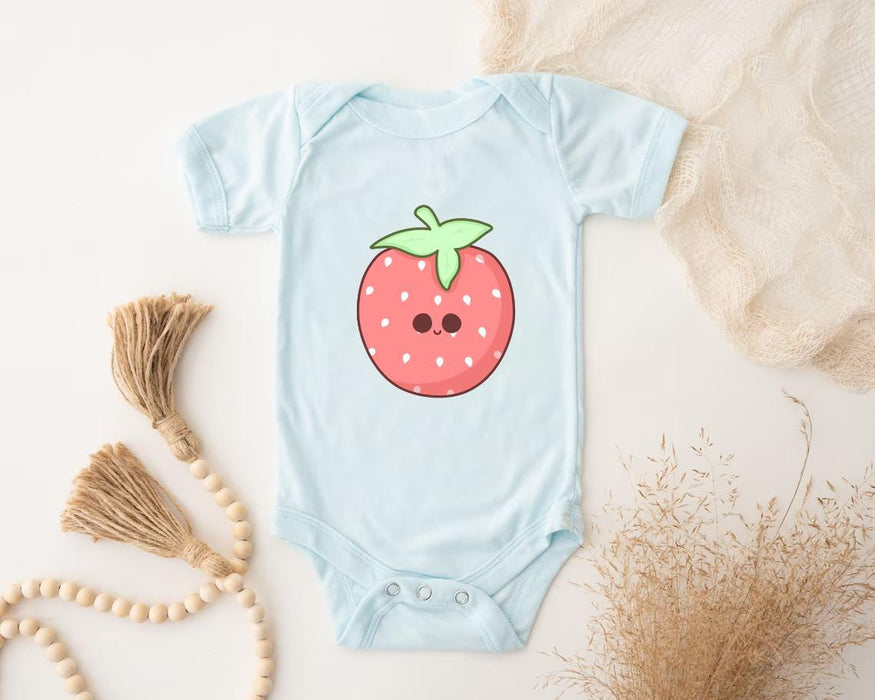 a baby bodysuit with a picture of a strawberry on it