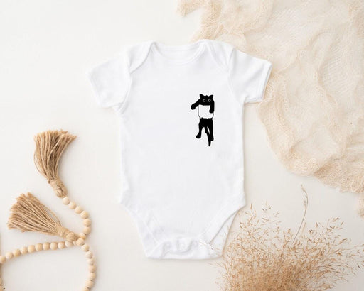 a white bodysuit with a black cat on it