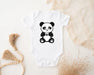 a baby bodysuit with a panda bear on it