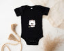 a black bodysuit with a white cat on it