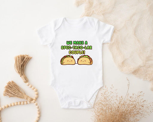 a baby bodysuit with two tacos printed on it