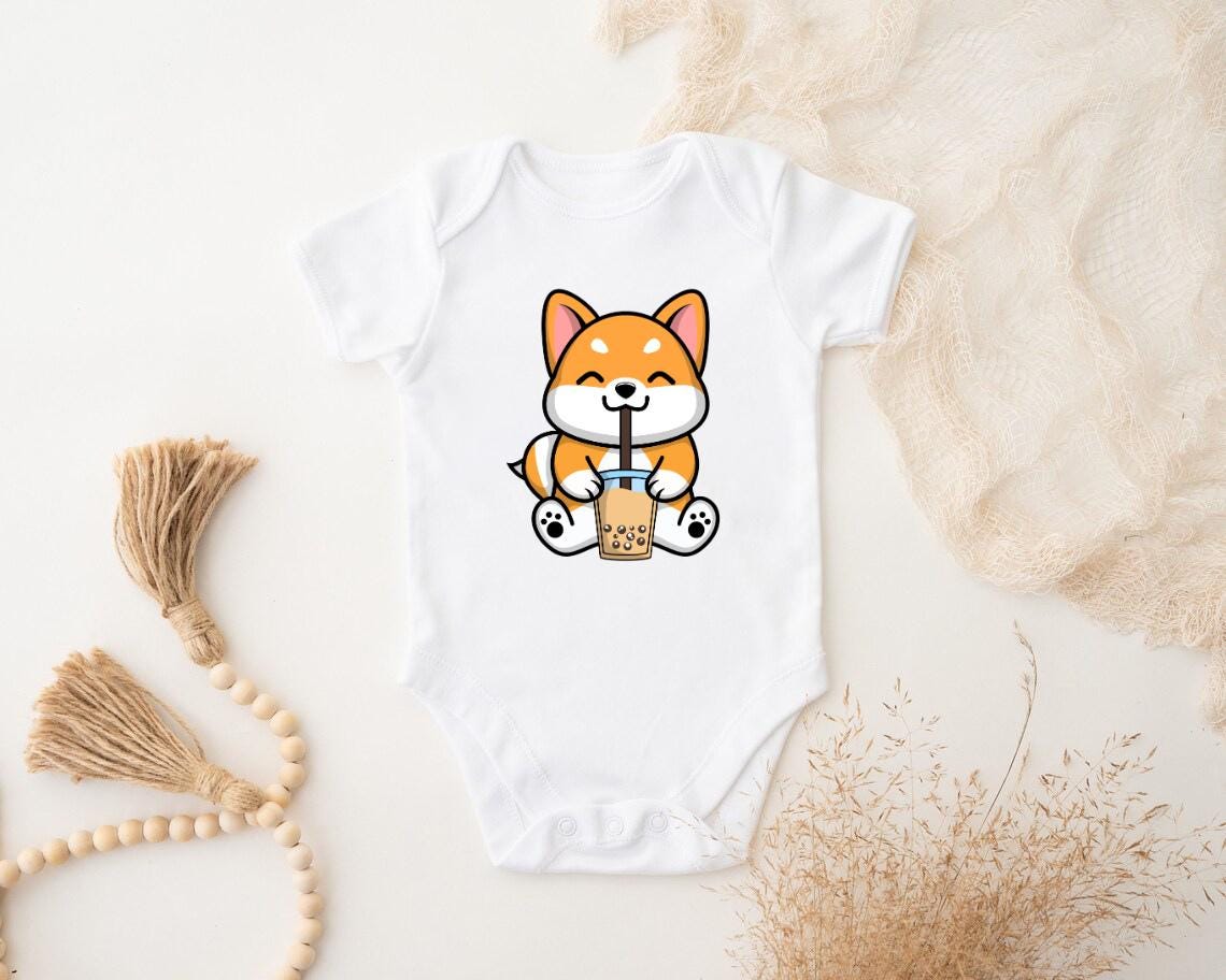 a baby bodysuit with a picture of a fox holding a drink