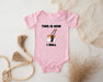a baby bodysuit with a picture of a cat on it