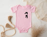 a pink baby bodysuit with a black cat on it