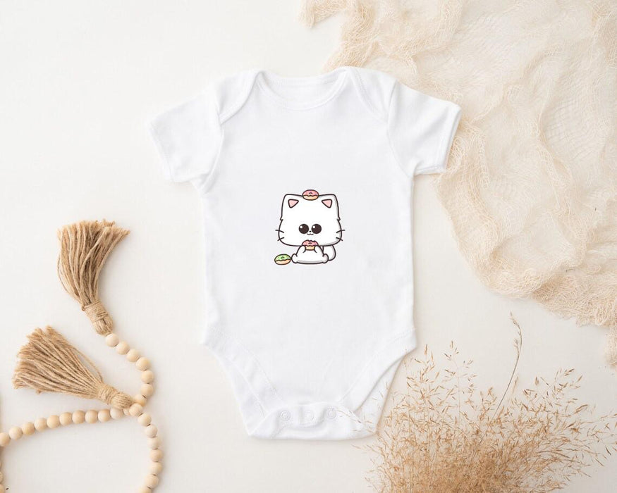 a white bodysuit with a picture of a cat on it