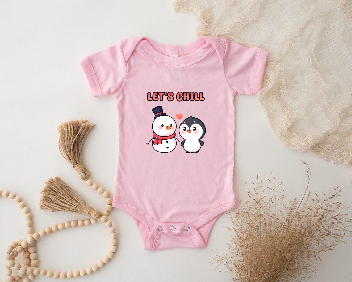 a pink baby bodysuit with two snowmen on it