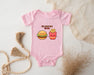 a baby bodysuit with a hamburger and fries on it