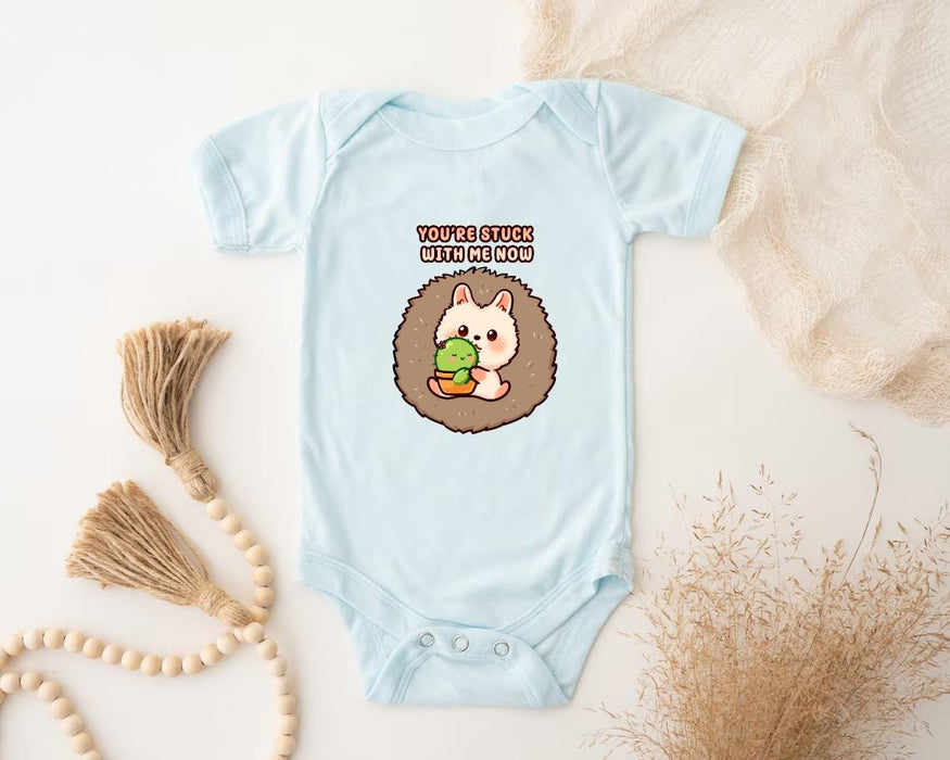 a baby bodysuit with a hedge holding a leaf