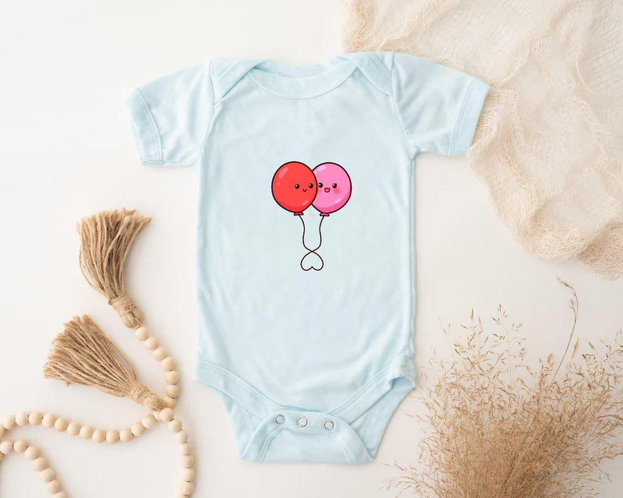 a baby bodysuit with two balloons on it