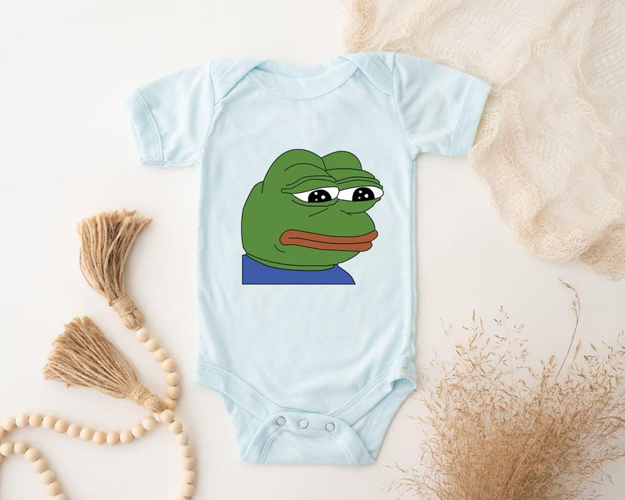 a bodysuit with a picture of a frog on it