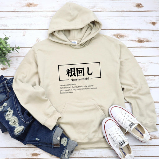 a white hoodie with japanese characters on it