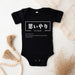 a black bodysuit with japanese characters on it
