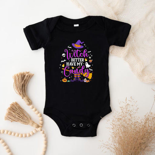 a black bodysuit with a witch saying on it