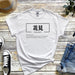 a white t - shirt with the words namshi written in chinese