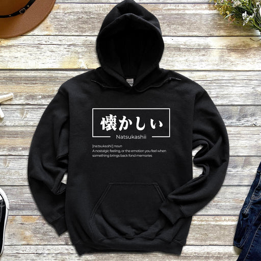 a black hoodie with japanese writing on it