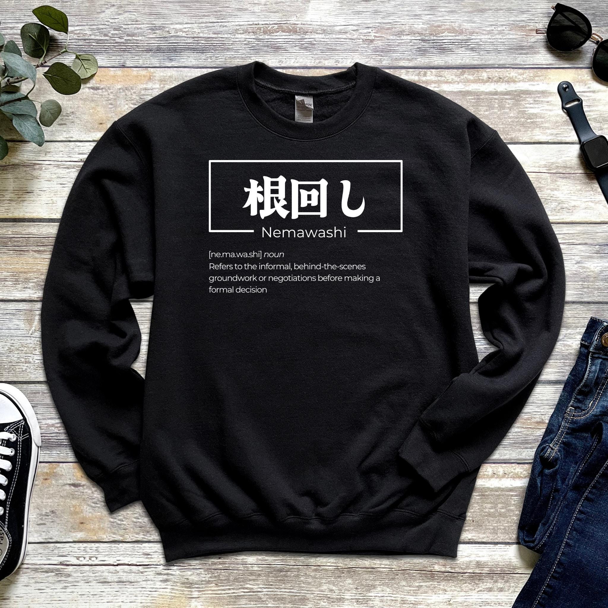 a black sweater with the words nemawash on it