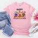 a pink t - shirt with the words happy halloween on it