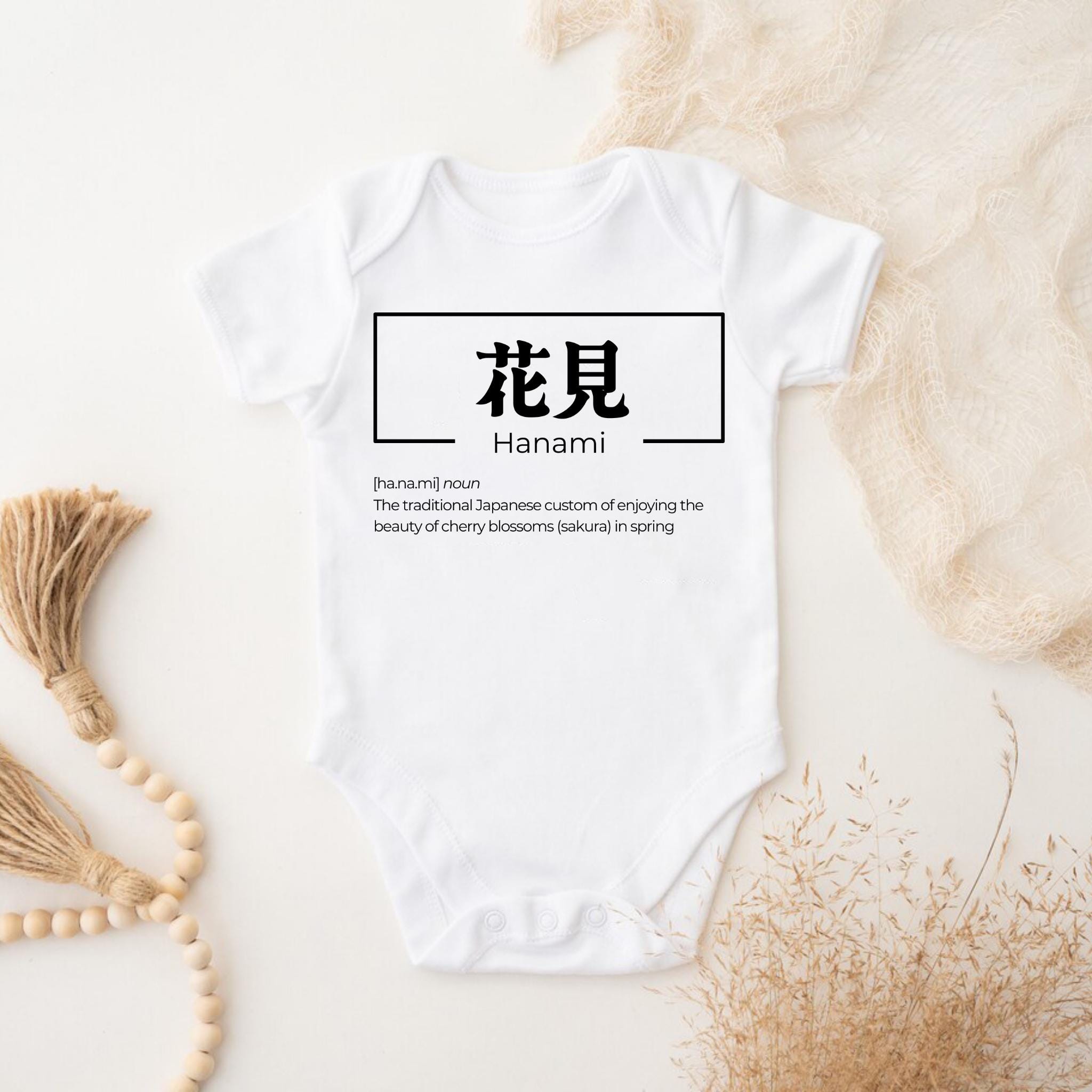 a white bodysuit with a chinese character on it