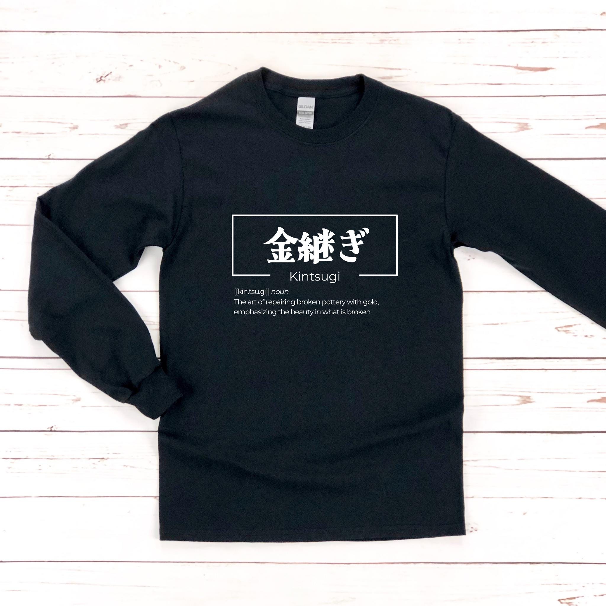 a black long - sleeved t - shirt with white writing on it