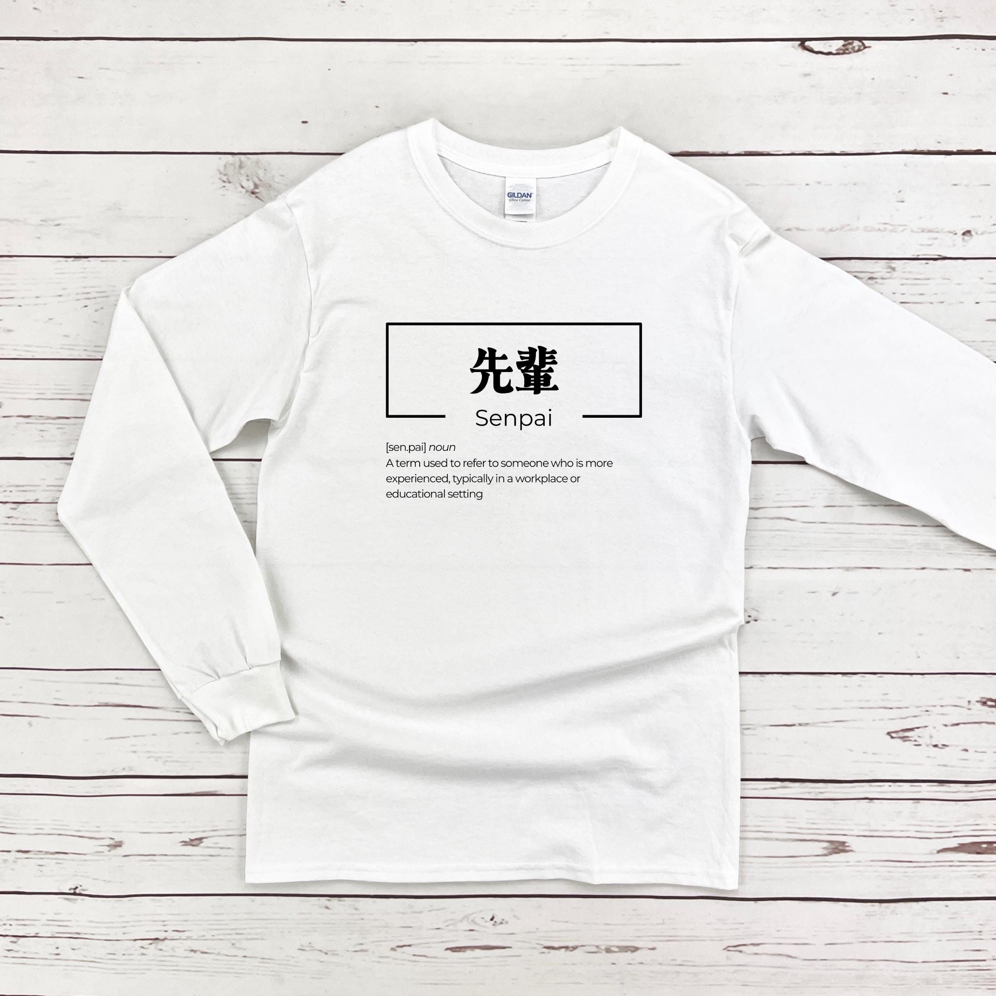 a white long - sleeved shirt with chinese characters on it