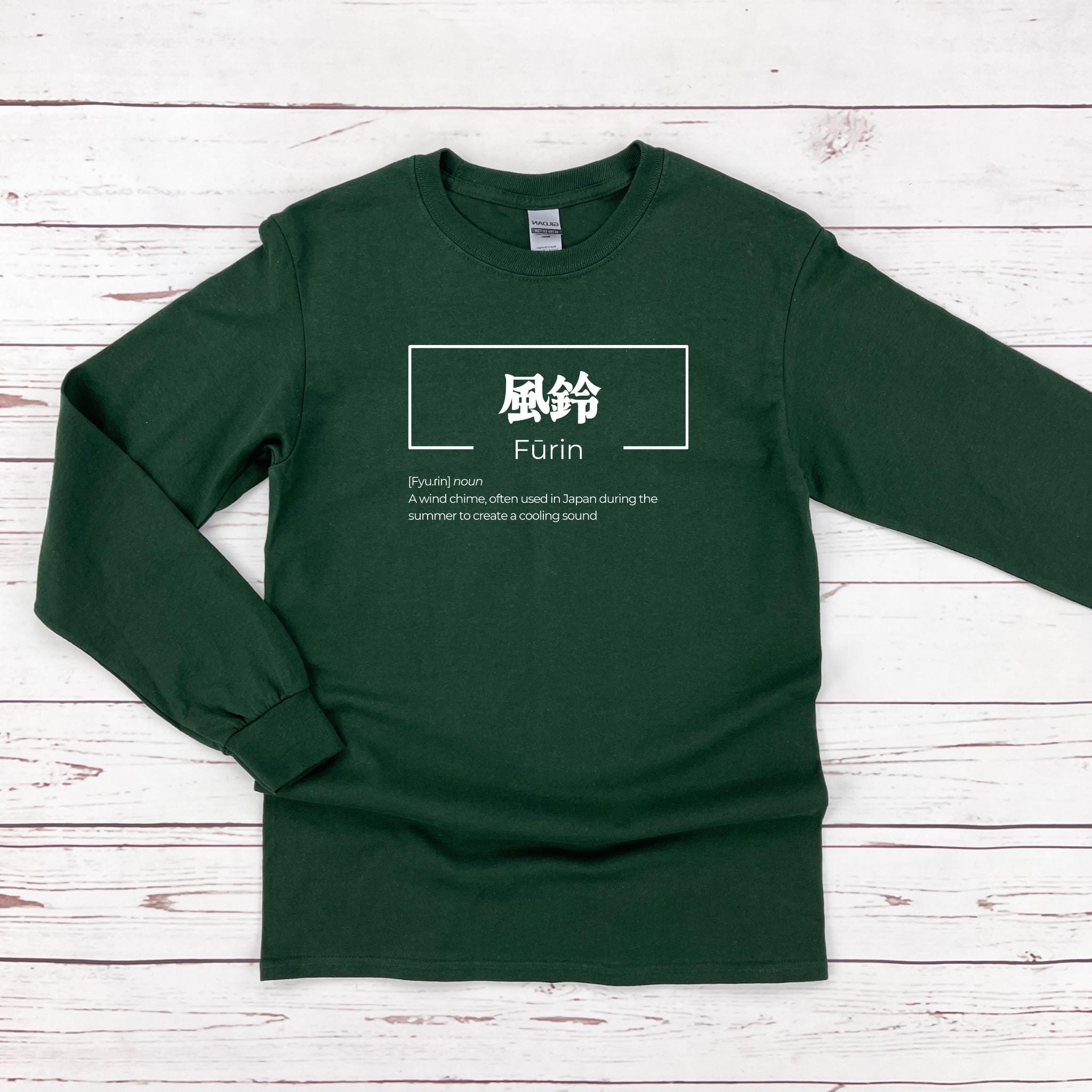 a green long - sleeved shirt with chinese characters on it