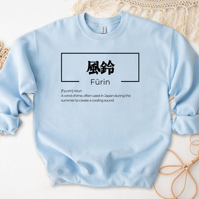 a blue sweatshirt with chinese writing on it
