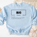 a blue sweatshirt with chinese writing on it