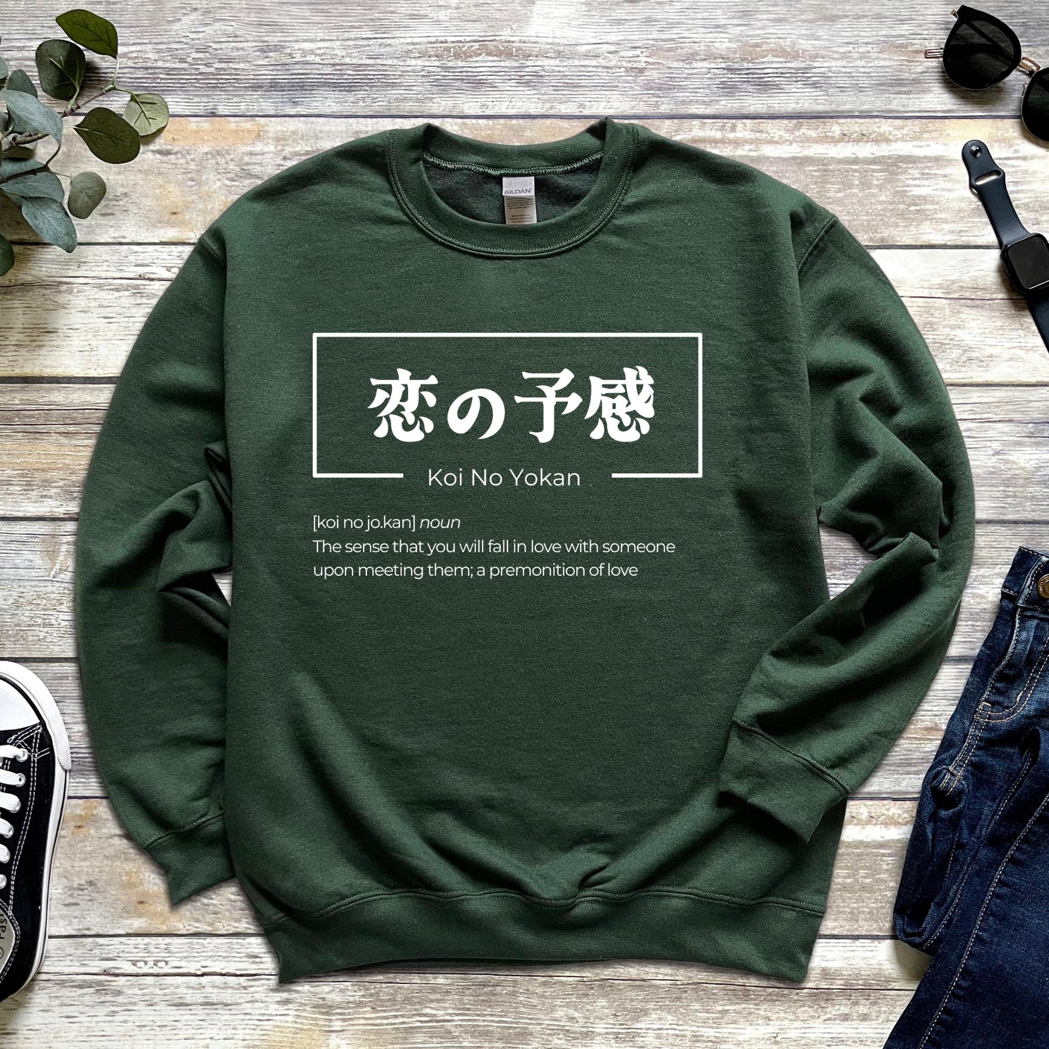 a green sweatshirt with chinese writing on it