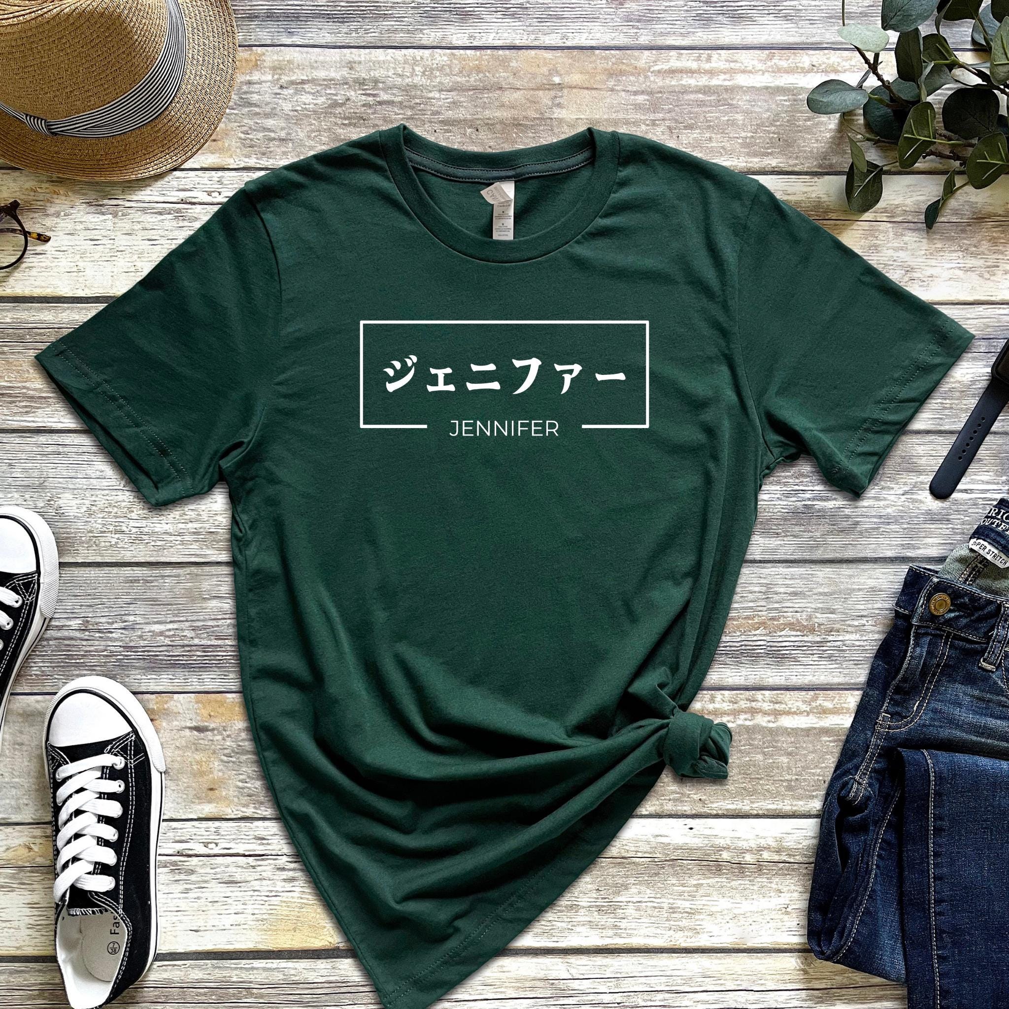 a green t - shirt with japanese characters on it