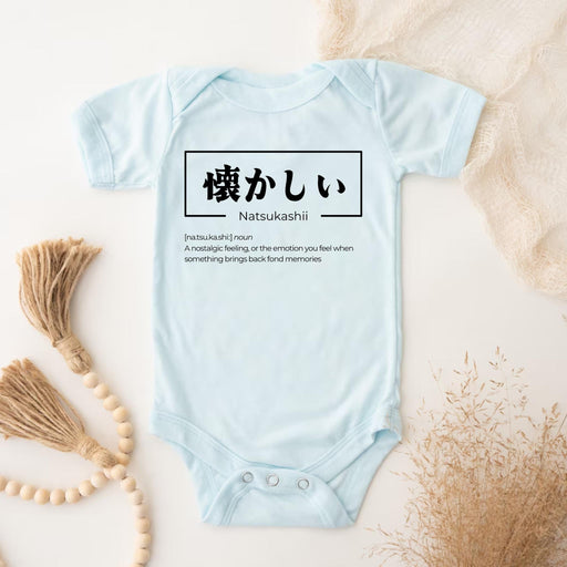 a baby bodysuit with japanese writing on it