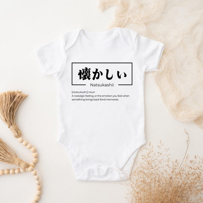 a baby bodysuit with japanese characters on it