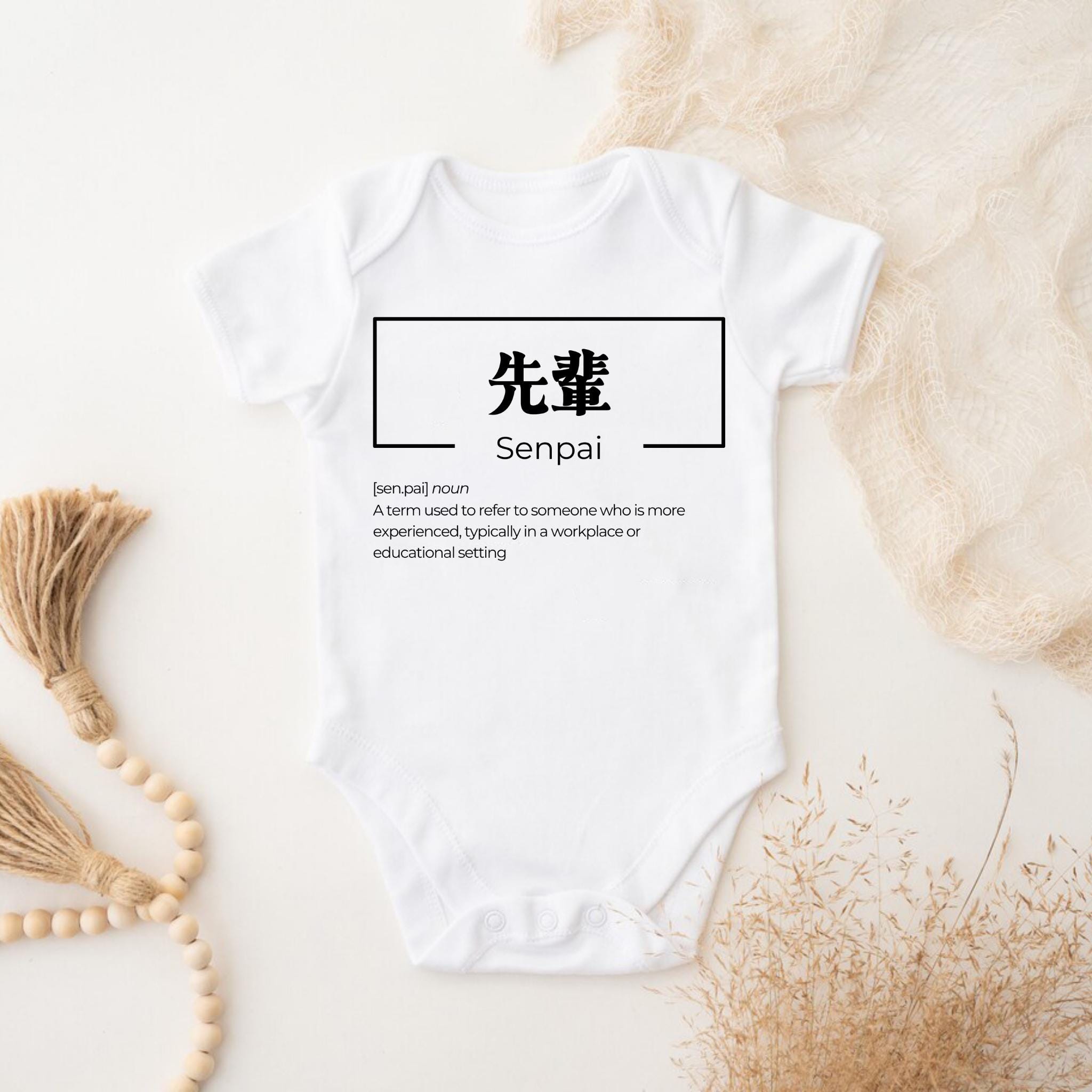 a white bodysuit with the words sempai on it